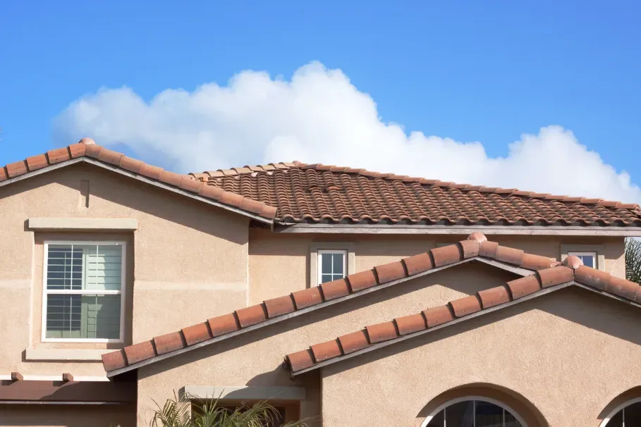Stucco exterior with terracotta tile roof